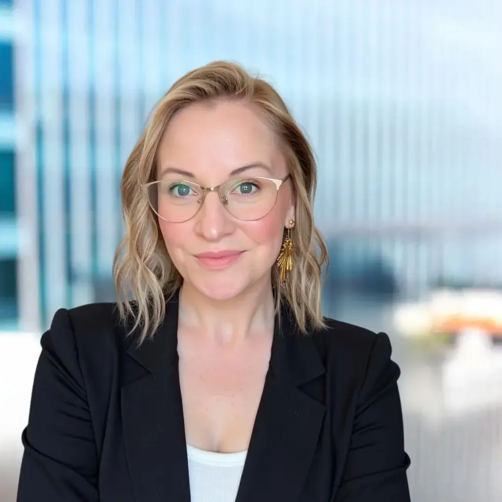 Professional woman in business attire, smiling portrait.